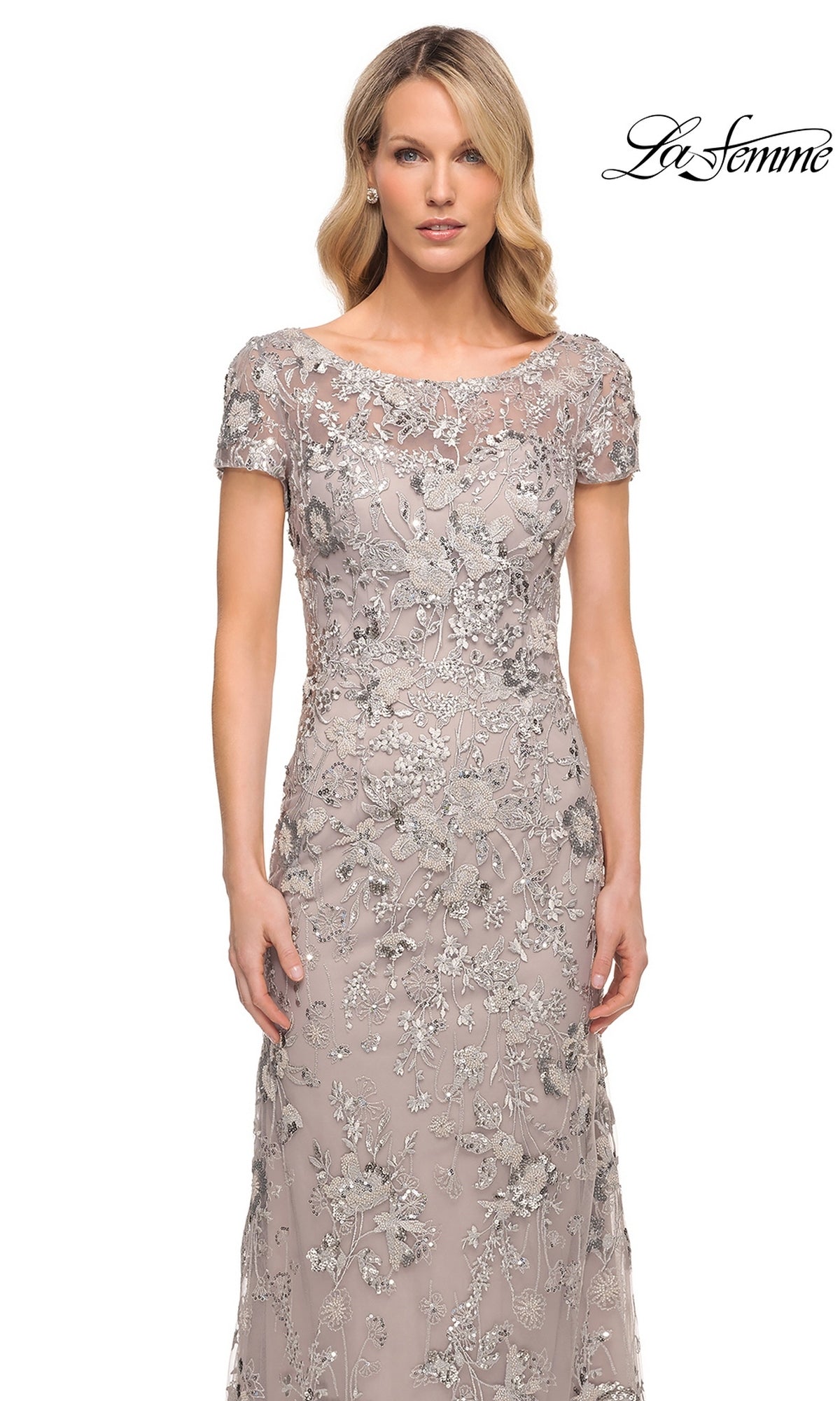 La Femme 30053 floor-length taupe sheath evening gown featuring a boat neckline, short sleeves, and intricate silver floral beadwork.